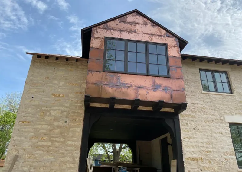 Copper metal panel facade on a stone building for Metal Roof Coating in Shamong