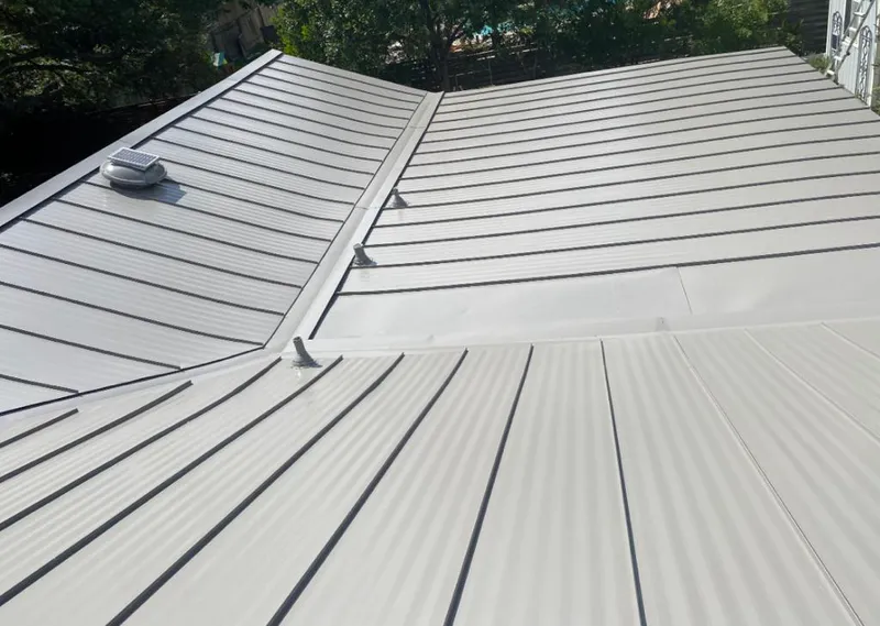 Solar attic fan installed on a metal roof for Roof Ventilation in Shamong
